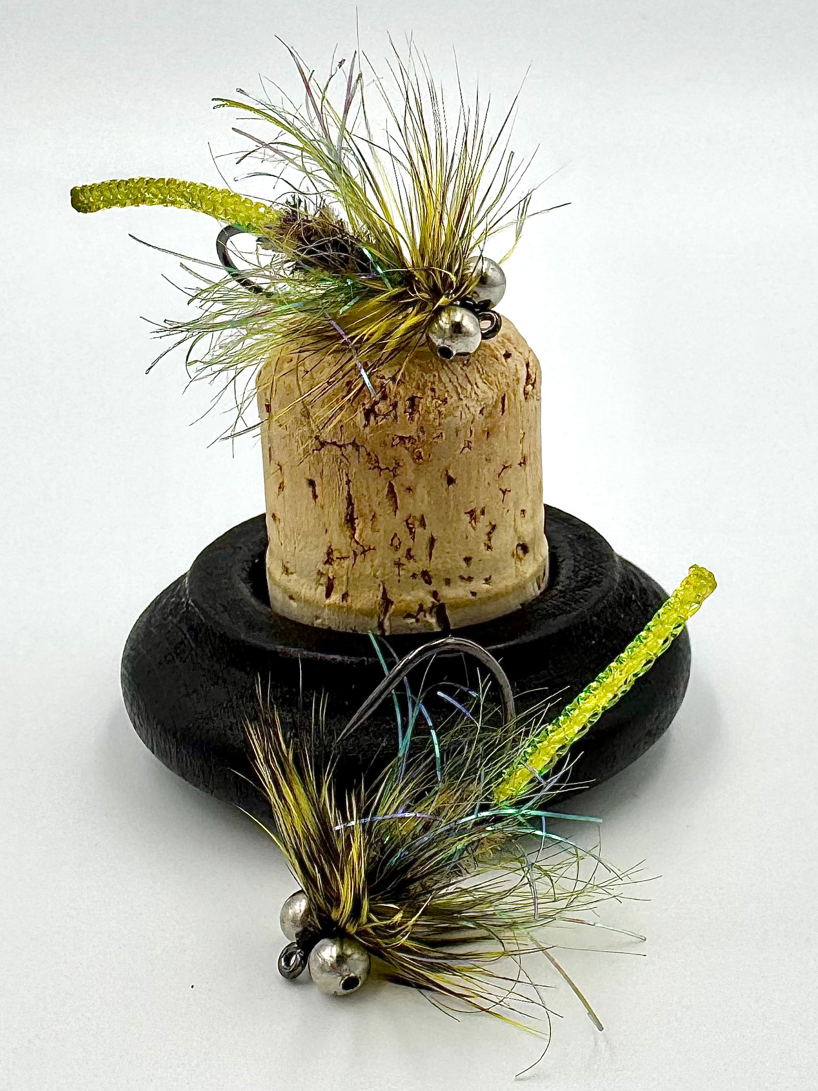 Bass Candy - Dirty Loaf bass fly with olive body and feather collar