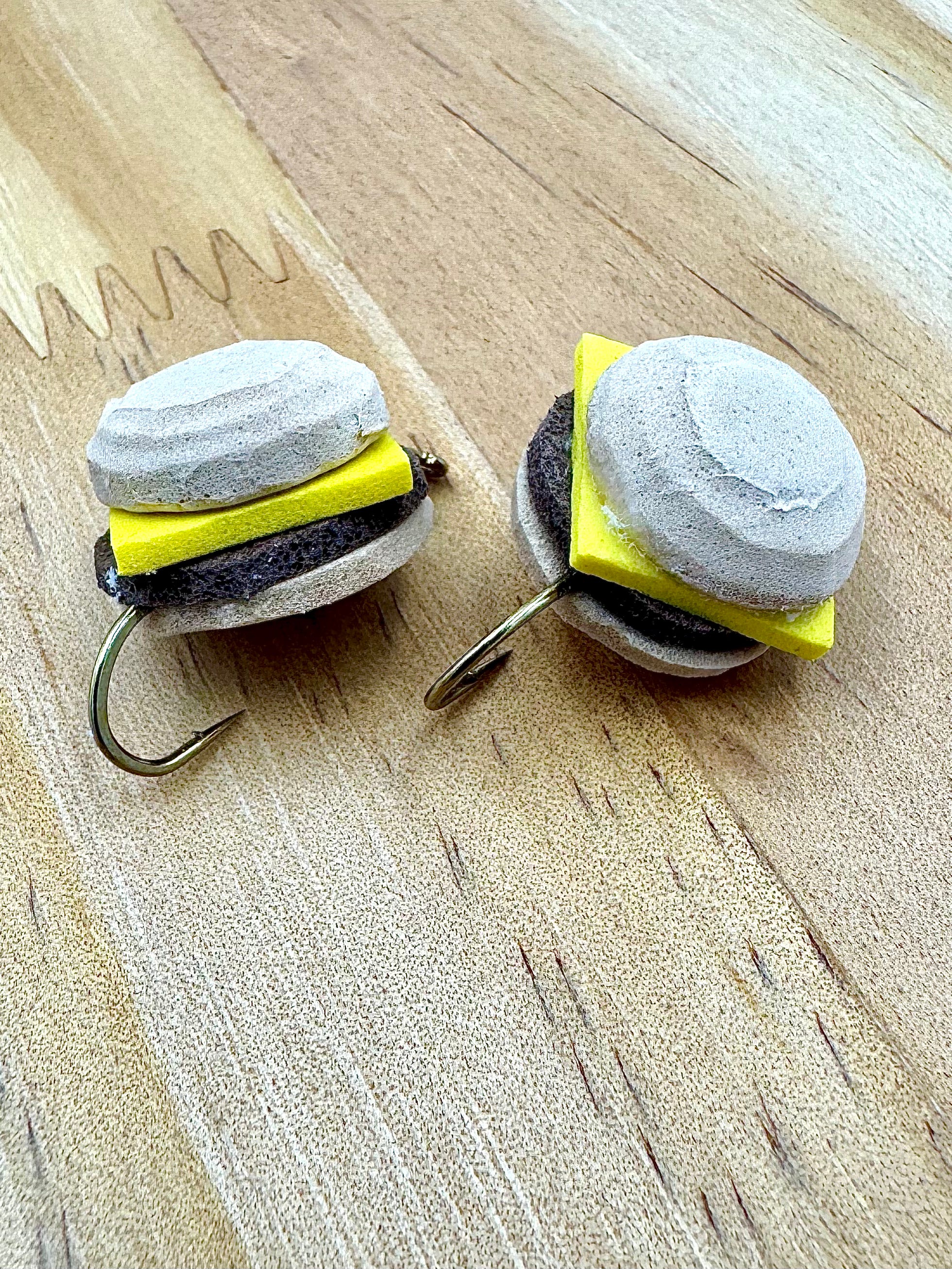 Bayou Burger novelty fishing fly with bun, patty, and cheese design